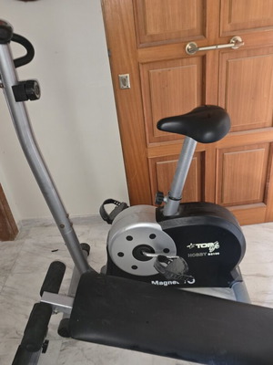 Stationary bike and incline abdominal bench used, good condition