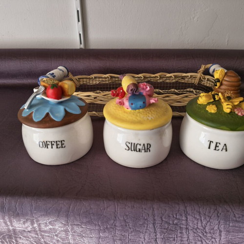 Set of 3 ceramic kitchen jars with handmade lids and wicker basket