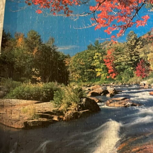 Puzzle board like new with river landscape and blooming tree