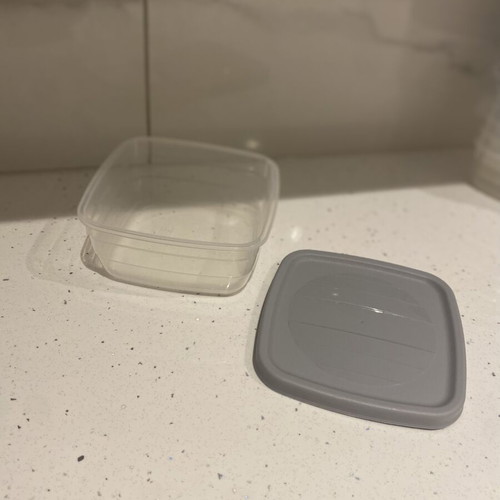 Set of small plastic food storage containers