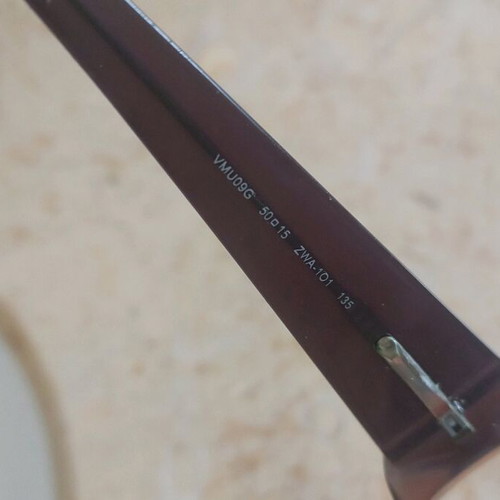 Miu Miu eyeglasses used with purple and orange acetate frame