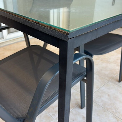 Garden table with glass top and 2 chairs used
