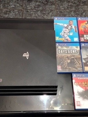 Sony PlayStation 4 Pro 1TB console with 5 games and cables