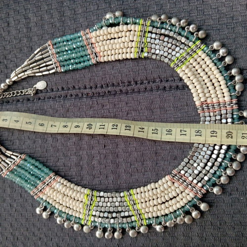Accessorize multistrand necklace with plastic and glass beads