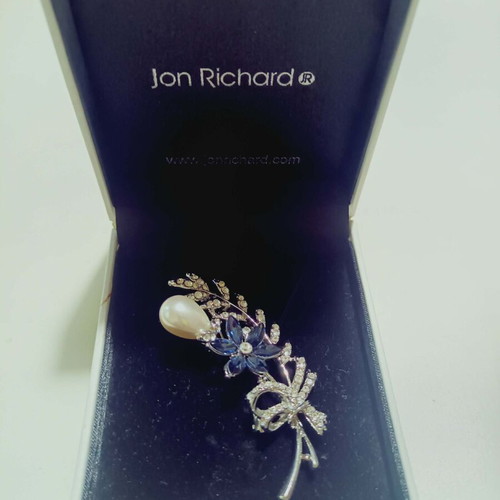 Pin new silver color with white and blue stones