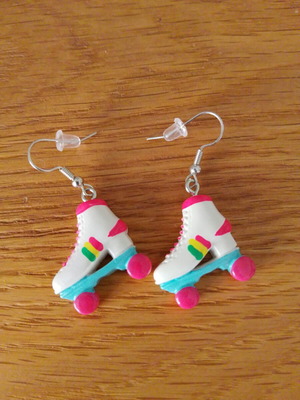 Earrings new with roller skate design