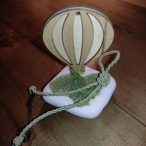 Decorative wooden hot air balloon on stone, used