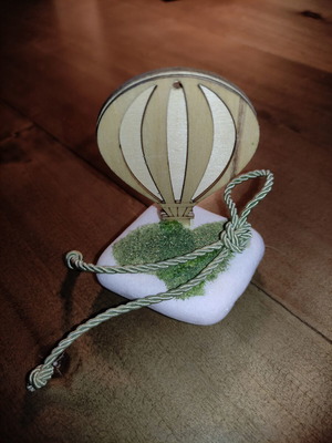 Decorative wooden hot air balloon on stone, used