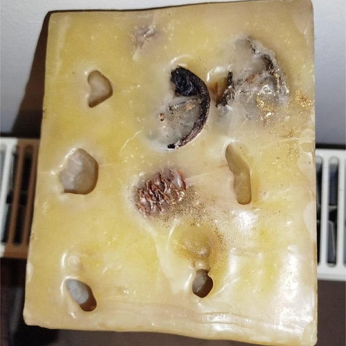 Decorative candle like new with pine cones and dried fruits