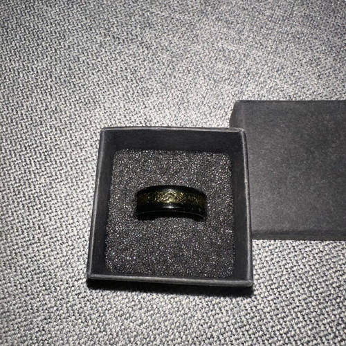 Ring with gold Celtic design on black base new