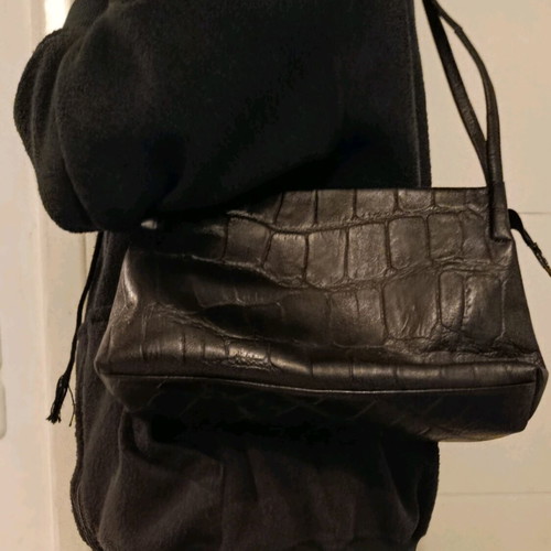 Black shoulder bag used with sturdy construction and multiple pockets