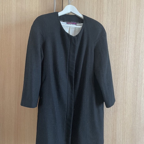 Black coat used with wool by Carling