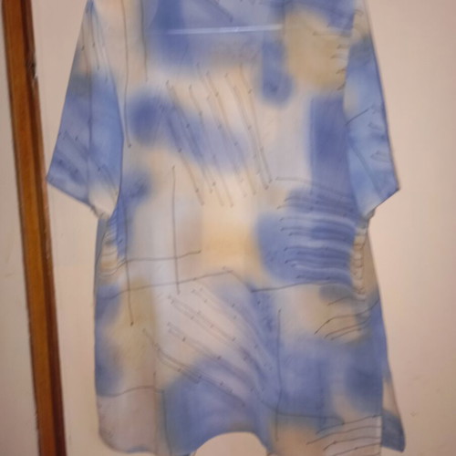 Light vintage women's shirt with short sleeves, buttons, collar, abstract print