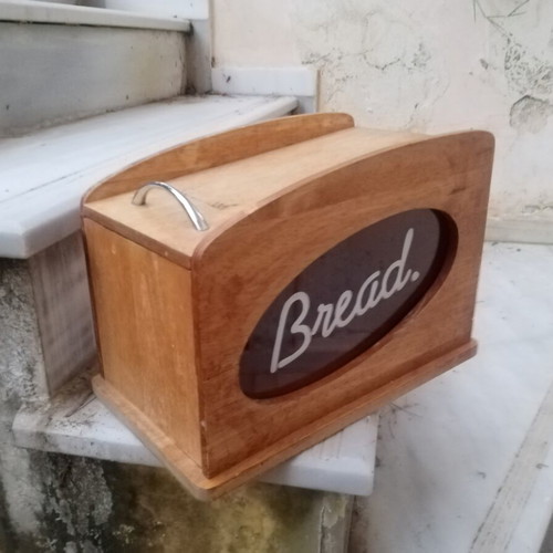 Wooden breadbox with hinged lid and metal handle used