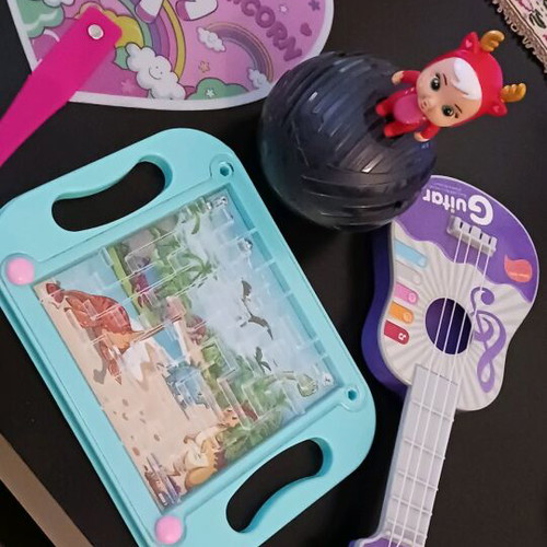 Gift set of 5 items like new with doll, ukulele, fan, puzzle and marble game