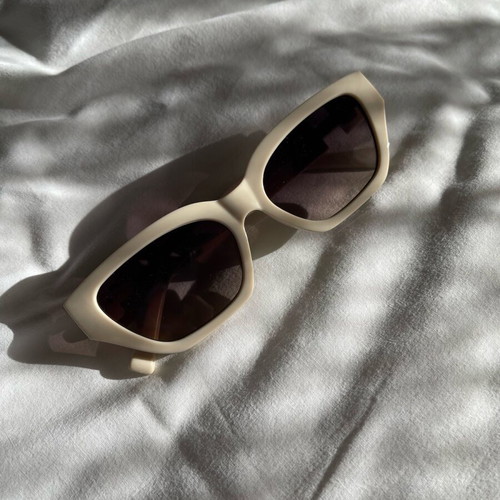 Sunglasses new, beige with metal decoration
