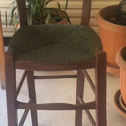 Wooden high chair with woven seat