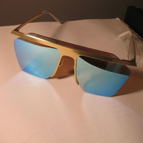 Stylish women's sunglasses with blue mirrored lenses, gold frame