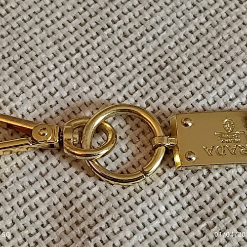Authentic Prada gold key ring unisex like new