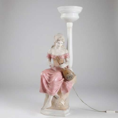 Statue of a woman playing a lute