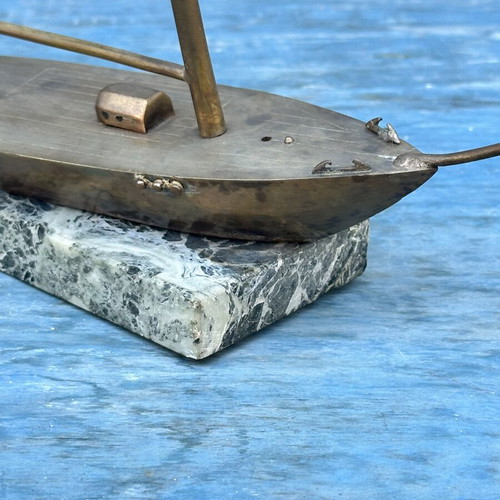 Vintage brass sailboat decoration on marble base, used