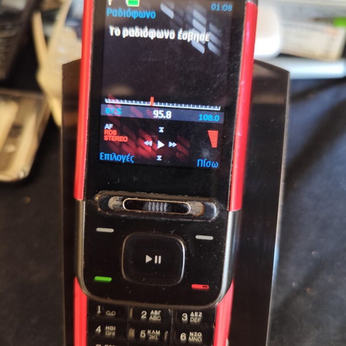 Nokia 5610 XpressMusic phone used with charger