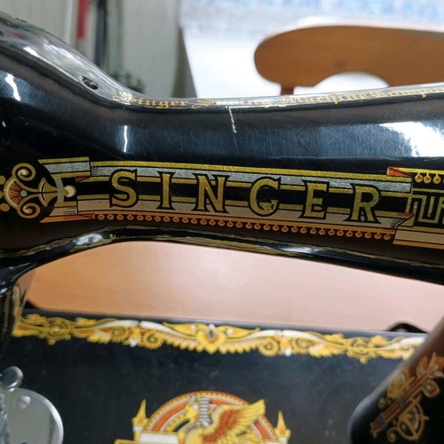 Singer antique sewing machine like new with cabinet