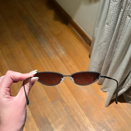 Sunglasses new with thin black frame and pink lens