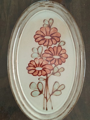 Vintage terracotta plaque with flower design