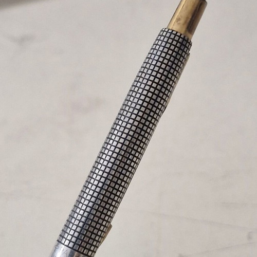 Parker pen in like new condition, possibly silver or silver-plated