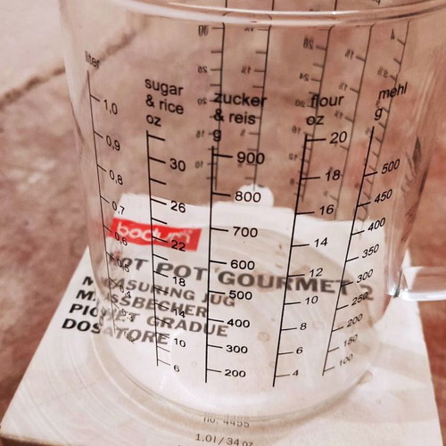 Glass measuring cup used for solids and liquids