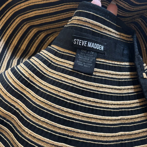 Steve Madden bucket hat with striped design and adjustable opening for ponytail
