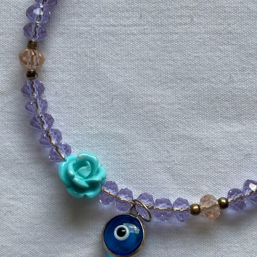 Lilac bracelet like new with beads and charms
