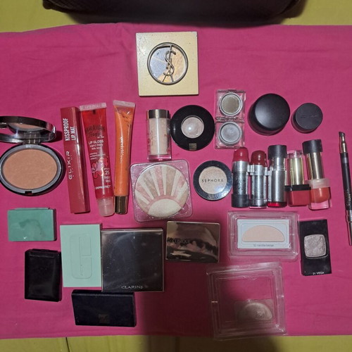 Large collection of branded cosmetics with YSL mirror and makeup bag
