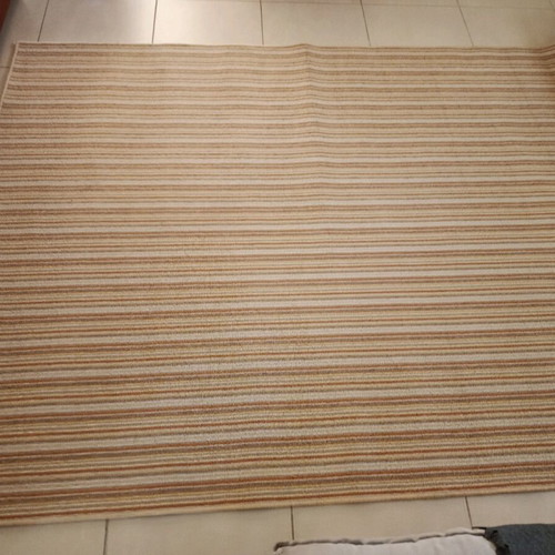 Used rug with beige, mustard, brown and terracotta stripes