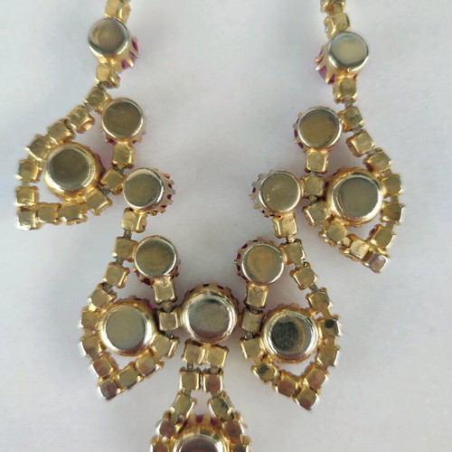 Antique necklace used with pink stones and gold rhinestones