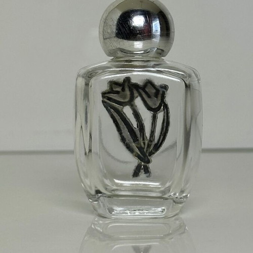 Vintage glass perfume bottle with metal tulip decoration
