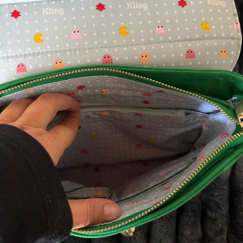 Green suede crossbody bag used with gold details