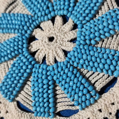Handmade knitted doilies used with crochet and beads