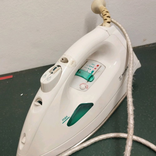 Handheld steam iron used
