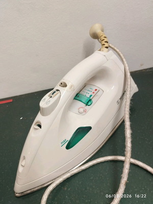 Handheld steam iron used