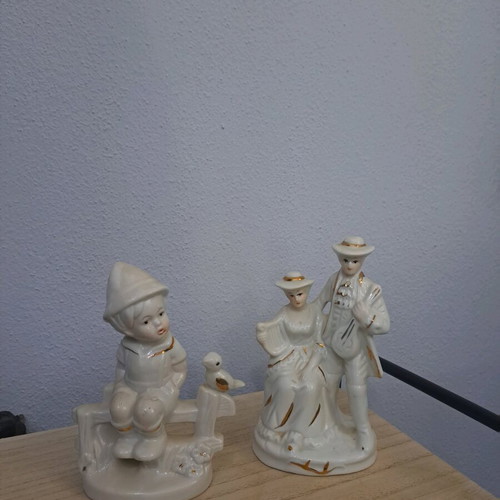 Vintage porcelain figurines set of 2 with gold trim like new