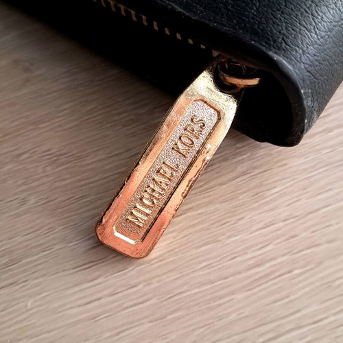 Michael Kors wallet used, black with gold monogram
