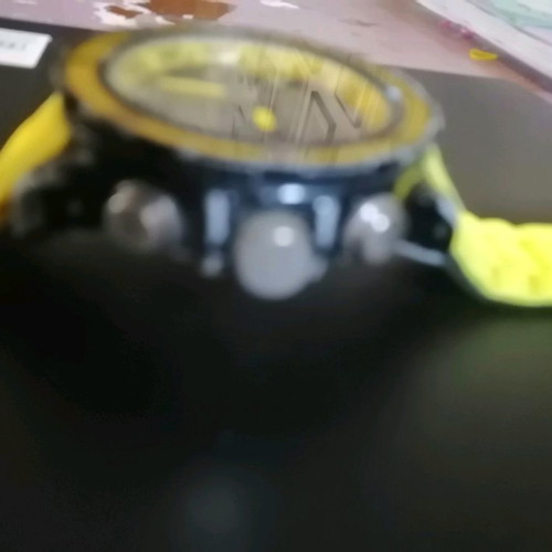 Watch with yellow strap missing one button, works