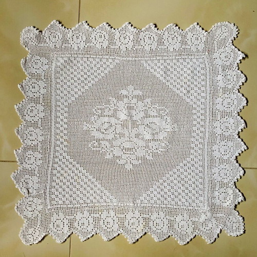 Handmade knitted square used with cotton thread
