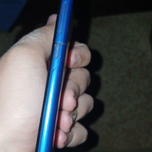 Alcatel phone used with cracks and scratches blue