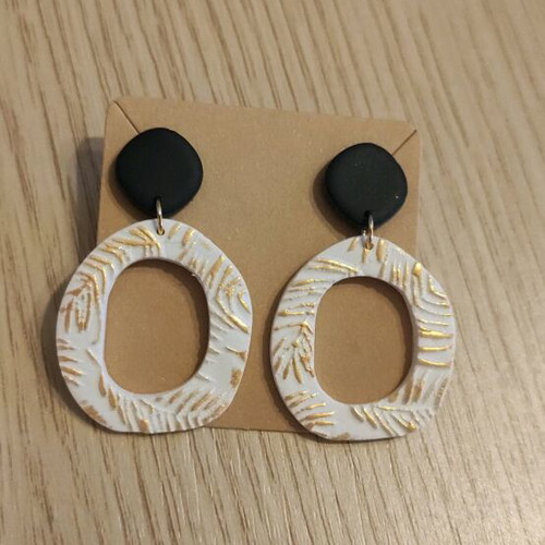 Earrings new, polymer clay with black, white, and gold colors