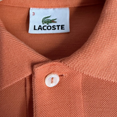 Lacoste polo shirt like new, size 3, peach color