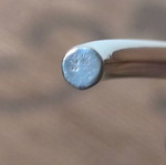 Silver neck rod like new with gold decorative details