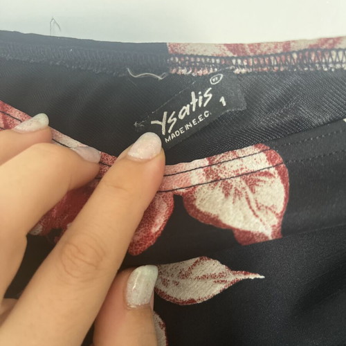 Black floral skirt with transparency medium, used